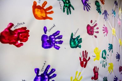 Handprints Colourful handprints on white canvas