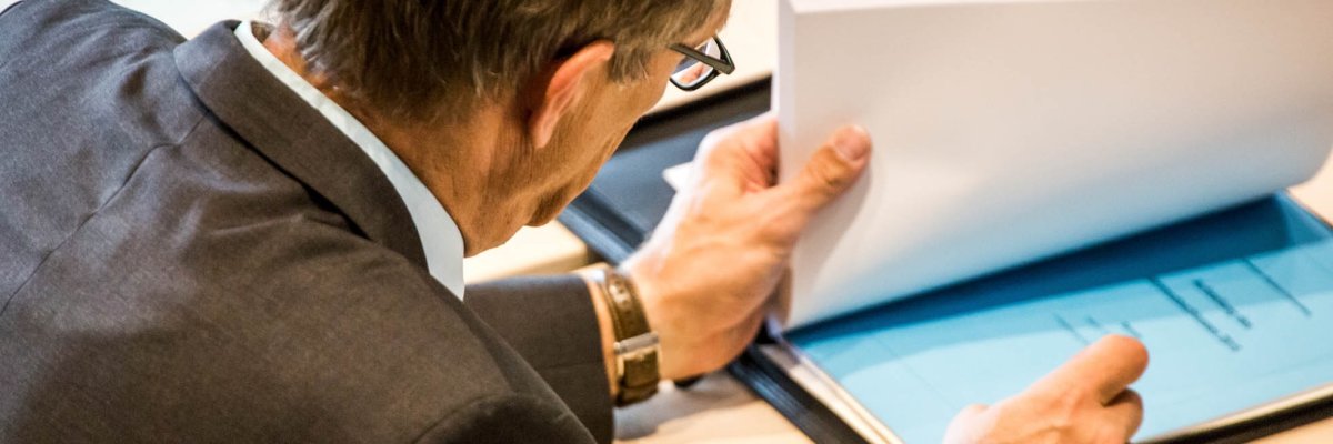 Man reads session documents