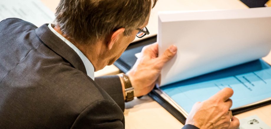 Man reads session documents