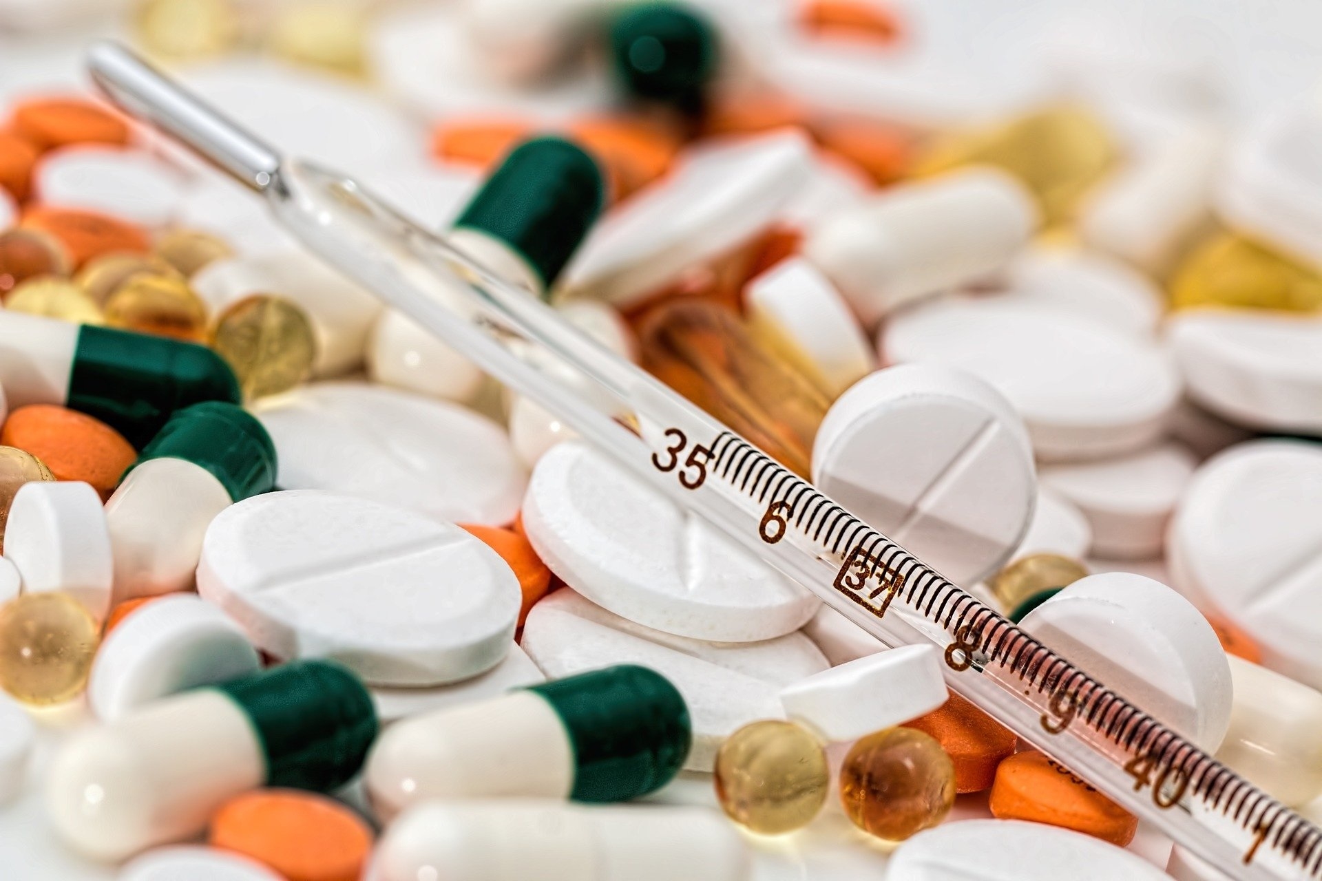 Medication Clinical thermometer on a pile of medicines