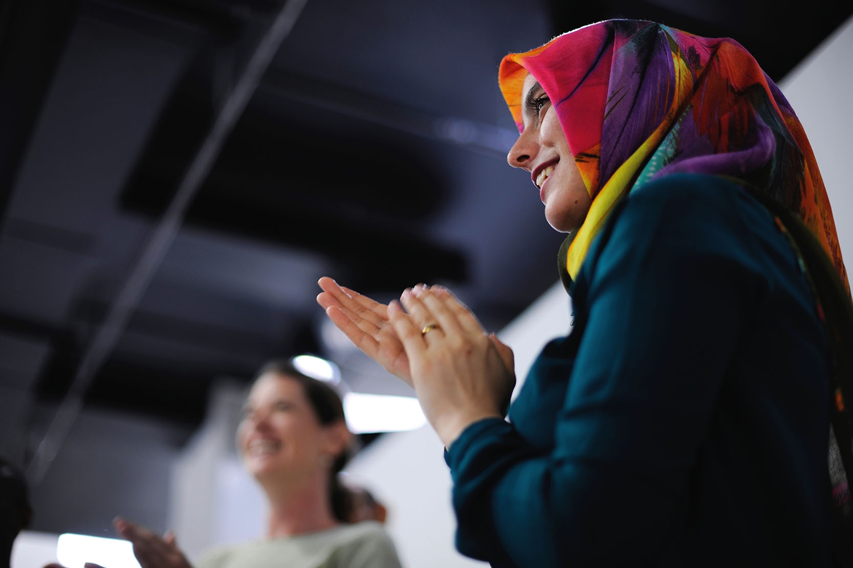 Woman with headscarf Smiling and clapping woman with headscarf