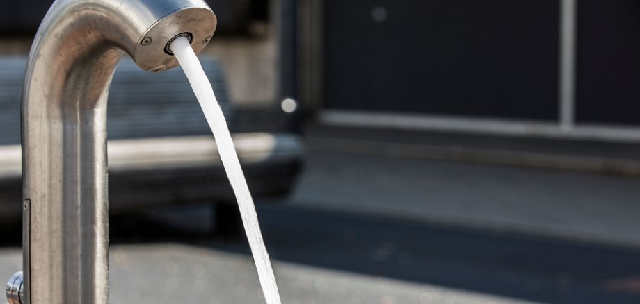 Water jet comes out of a well water tap