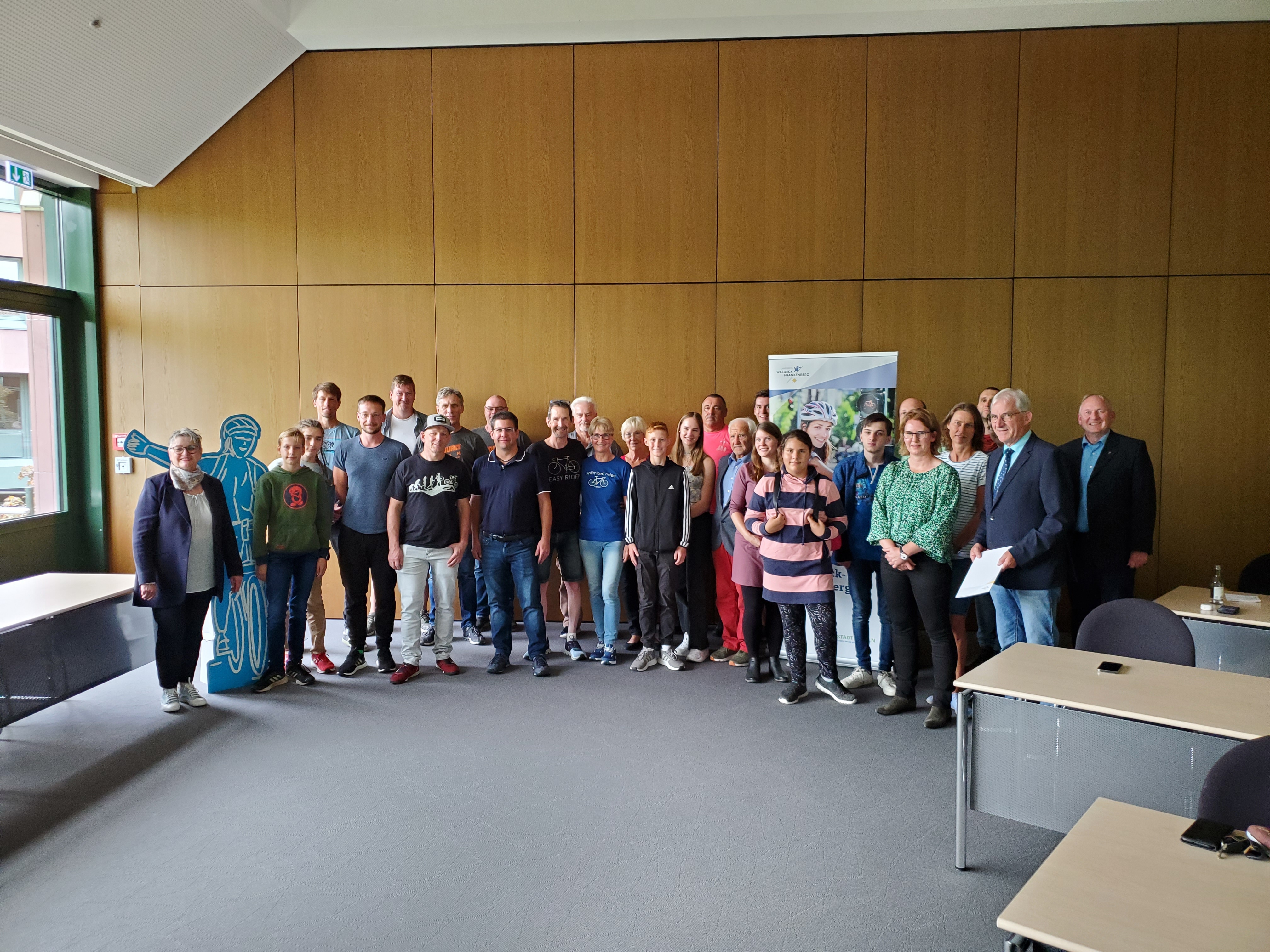 First District Councillor Frese presents the certificates to the winners of the city and school cycling events.